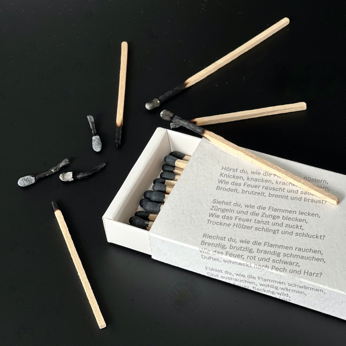 Lange Streichhölzer mit Gedicht.