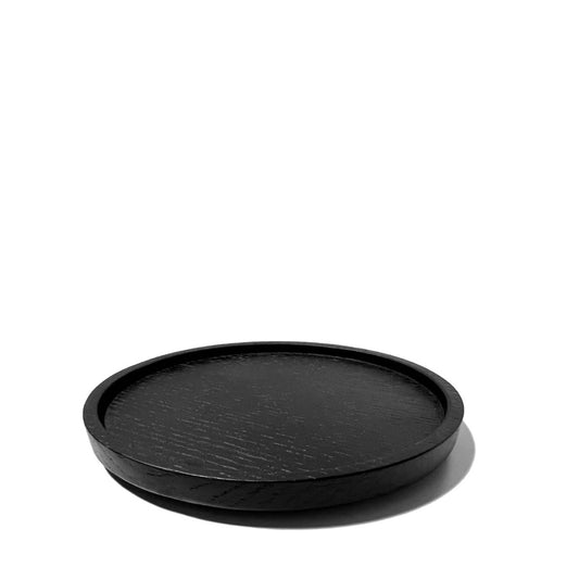 Untersetzer 'Passe-Partout' nach einem Entwurf Vincent van Duysen für Serax. Ø 12 aus Eschenholz.